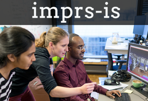 Image of young PhD students working at a computer