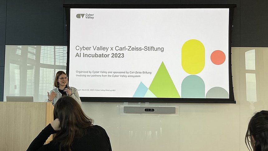 A woman presenting the Cyber Valley AI Incubator 2023